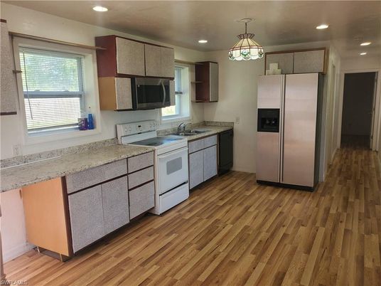 Interior, Kitchen, Pendant Lights, Recessed Lighting, Stainless Steel Appliances, Wood Texture Flooring