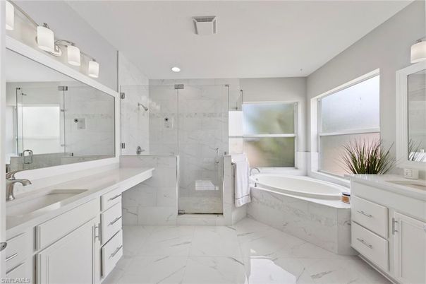Bathroom, Dual Sink Vanities, Glass Shower, Interior, Marble, Marble Walls, Recessed Lighting