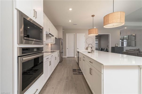 Interior, Kitchen, Pendant Lights, Recessed Lighting, Stainless Steel Appliances, Wood Texture Flooring