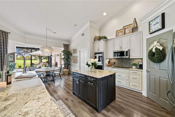 Chandelier, Dining room, Interior, Kitchen, Pendant Lights, Recessed Lighting, Stainless Steel Appliances, Wood Texture Flooring