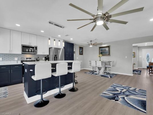 Dining room, Interior, Kitchen, Pendant Lights, Recessed Lighting, Stainless Steel Appliances, Wood Texture Flooring