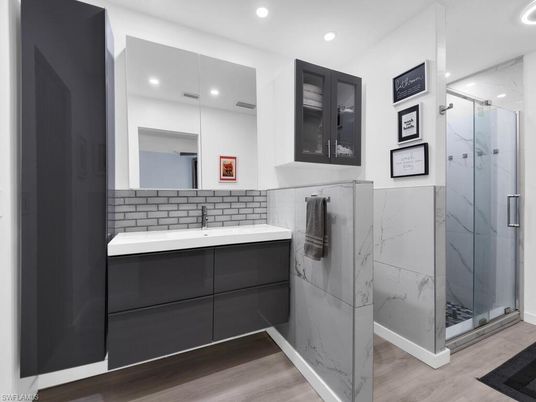 Bathroom, Glass Shower, Interior, Marble Walls, Recessed Lighting, Wood Texture Flooring