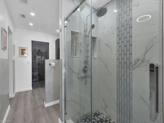 Bathroom, Glass Shower, Interior, Marble Walls, Recessed Lighting, Wood Texture Flooring