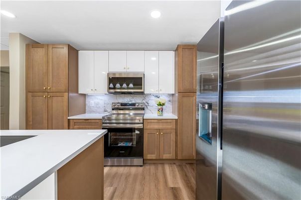 Interior, Kitchen, Recessed Lighting, Stainless Steel Appliances, Wood Texture Flooring