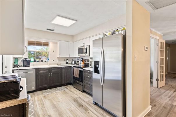 Interior, Kitchen, Recessed Lighting, Stainless Steel Appliances, Wood Texture Flooring