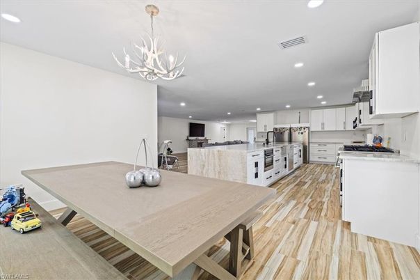 Chandelier, Interior, Kitchen, Pendant Lights, Recessed Lighting, Stainless Steel Appliances, Wood Texture Flooring