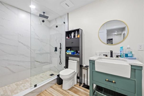 Bathroom, Glass Shower, Interior, Marble Walls, Recessed Lighting, Wood Texture Flooring
