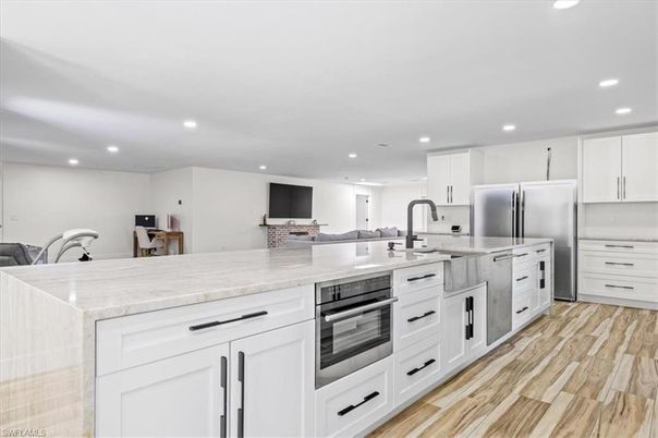 Interior, Kitchen, Recessed Lighting, Stainless Steel Appliances, Wood Texture Flooring