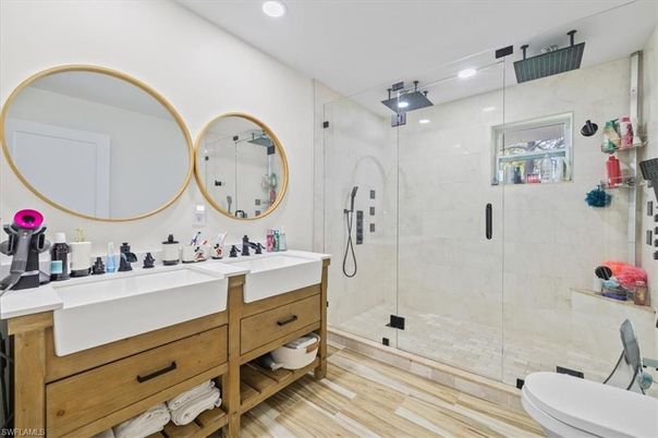 Bathroom, Dual Sink Vanities, Glass Shower, Interior, Recessed Lighting, Wood Texture Flooring