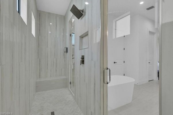 Bathroom, Free Standing Baths, Glass Shower, Interior, Marble, Marble Walls, Recessed Lighting