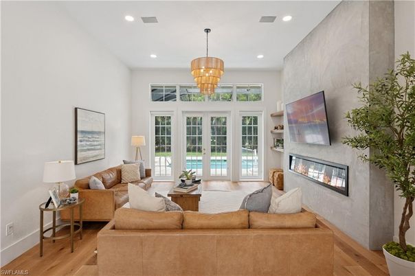 Chandelier, Fireplace, Interior, Living room, Recessed Lighting, Wood Texture Flooring