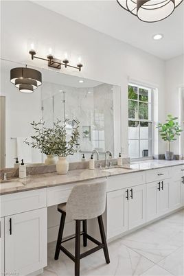 Bathroom, Dual Sink Vanities, Glass Shower, Interior, Marble, Marble Walls, Recessed Lighting