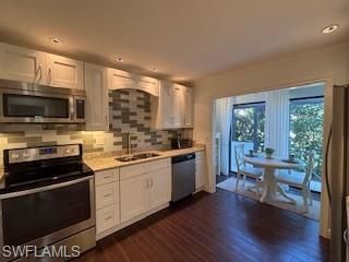 Dining room, Interior, Kitchen, Recessed Lighting, Stainless Steel Appliances, Wood Texture Flooring