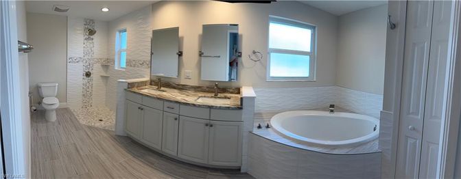 Bathroom, Dual Sink Vanities, Interior, Recessed Lighting, Wood Texture Flooring