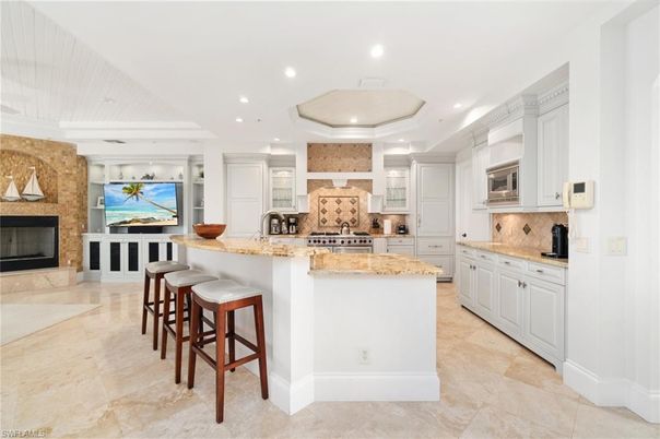 Fireplace, Interior, Kitchen, Recessed Lighting, Stainless Steel Appliances, Stone Walls