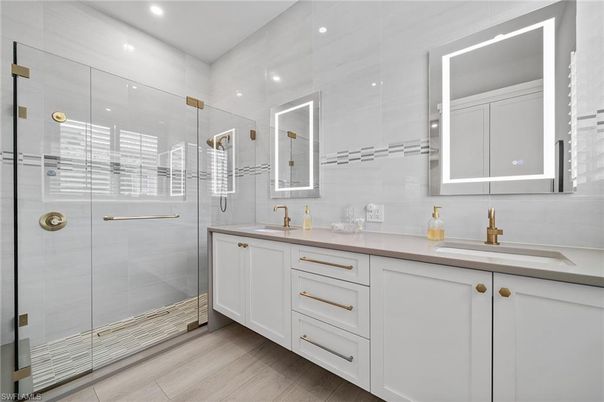Bathroom, Dual Sink Vanities, Glass Shower, Interior, Recessed Lighting, Wood Texture Flooring