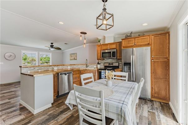Dining room, Interior, Kitchen, Pendant Lights, Recessed Lighting, Stainless Steel Appliances, Wood Texture Flooring