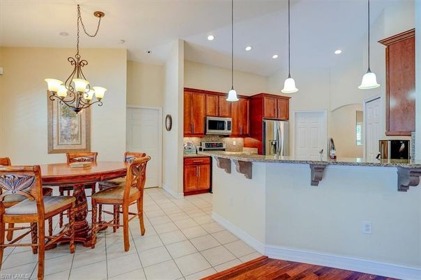Chandelier, Dining room, Interior, Kitchen, Pendant Lights, Recessed Lighting, Stainless Steel Appliances, Wood Texture Flooring