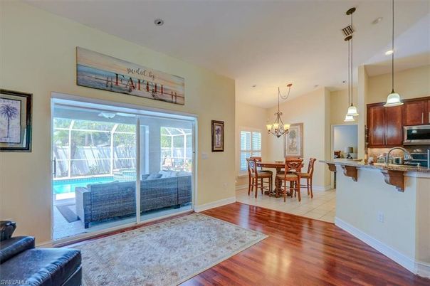 Chandelier, Dining room, Interior, Kitchen, Pendant Lights, Recessed Lighting, Stainless Steel Appliances, Wood Texture Flooring