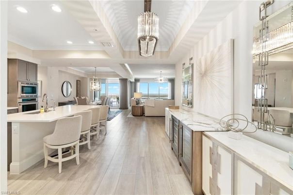 Chandelier, Dining room, Interior, Kitchen, Living room, Pendant Lights, Recessed Lighting, Stainless Steel Appliances, Water, Wood Texture Flooring