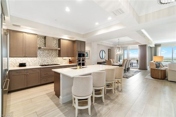 Chandelier, Dining room, Interior, Kitchen, Pendant Lights, Recessed Lighting, Stainless Steel Appliances, Water, Wood Texture Flooring