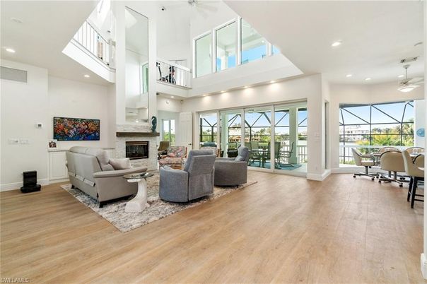 Dining room, Fireplace, Interior, Living room, Recessed Lighting, Wood Texture Flooring