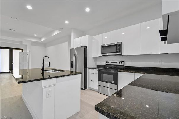 Interior, Kitchen, Recessed Lighting, Stainless Steel Appliances, Wood Texture Flooring