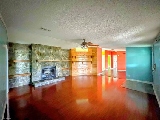 Empty room, Fireplace, Interior, Stone Walls, Wood Texture Flooring