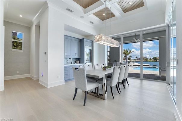 Chandelier, Dining room, Interior, Pendant Lights, Recessed Lighting, Water, Wooden Ceilings, Wood Texture Flooring