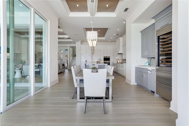 Chandelier, Dining room, Interior, Kitchen, Recessed Lighting, Stainless Steel Appliances, Wooden Ceilings, Wood Texture Flooring