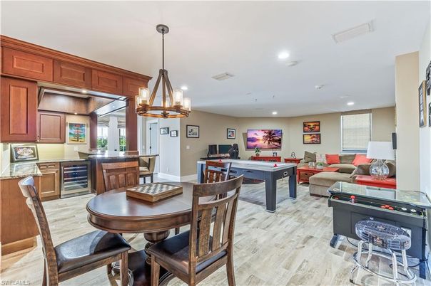 Billiard Table, Chandelier, Dining room, Game Room, Interior, Kitchen, Living room, Pendant Lights, Recessed Lighting, Wood Texture Flooring