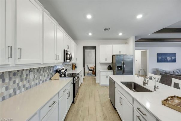 Interior, Kitchen, Recessed Lighting, Stainless Steel Appliances, Wood Texture Flooring