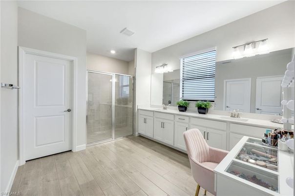 Bathroom, Dual Sink Vanities, Glass Shower, Interior, Recessed Lighting, Wood Texture Flooring