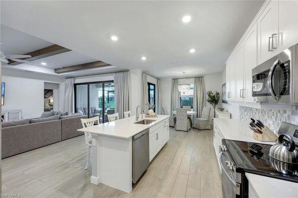 Dining room, Interior, Kitchen, Living room, Pendant Lights, Recessed Lighting, Stainless Steel Appliances, Wooden Beams, Wood Texture Flooring
