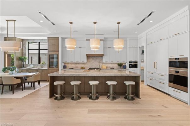 Dining room, Interior, Kitchen, Pendant Lights, Recessed Lighting, Stainless Steel Appliances, Wood Texture Flooring