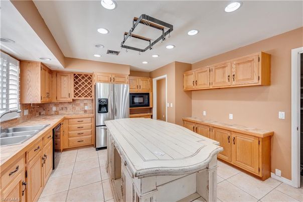 Interior, Kitchen, Recessed Lighting, Stainless Steel Appliances, Tile Countertops