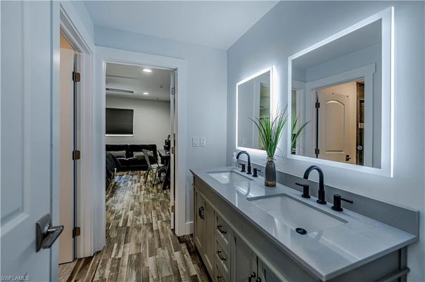 Bathroom, Dual Sink Vanities, Interior, Recessed Lighting, Wood Texture Flooring