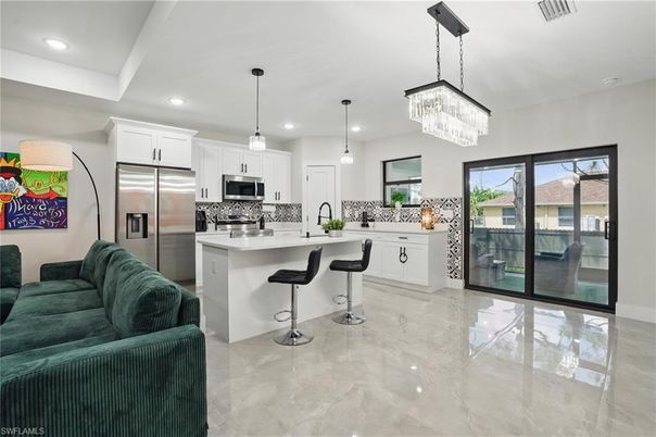 Chandelier, Interior, Kitchen, Marble, Pendant Lights, Recessed Lighting, Stainless Steel Appliances