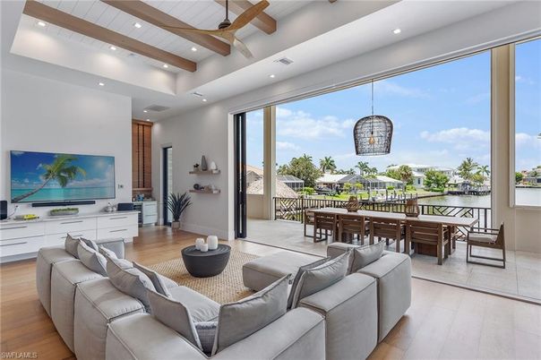 Dining room, Interior, Living room, Pendant Lights, Recessed Lighting, Water, Wooden Beams, Wood Texture Flooring