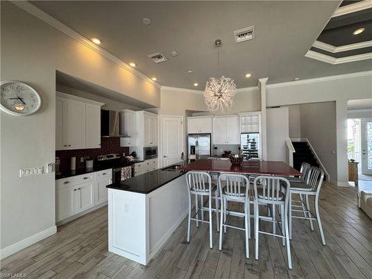 Chandelier, Interior, Kitchen, Pendant Lights, Recessed Lighting, Stainless Steel Appliances, Wood Texture Flooring