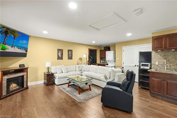 Fireplace, Interior, Living room, Recessed Lighting, Stone Walls, Wood Texture Flooring