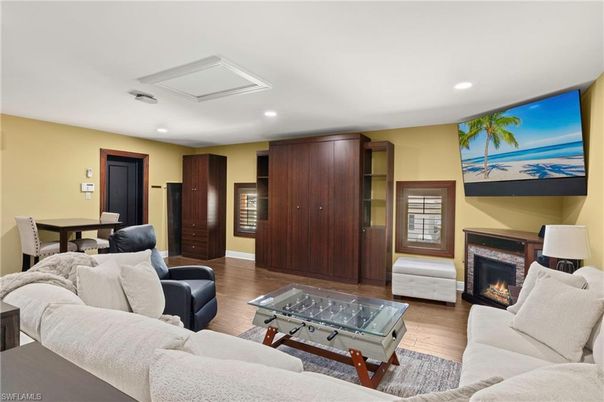 Dining room, Fireplace, Interior, Living room, Recessed Lighting, Wood Texture Flooring