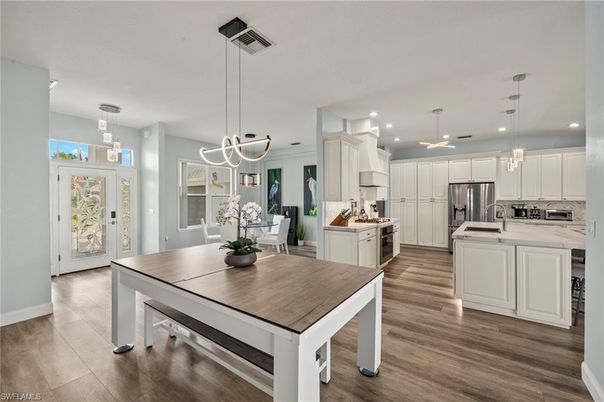 Dining room, Interior, Kitchen, Pendant Lights, Recessed Lighting, Stainless Steel Appliances, Wood Texture Flooring