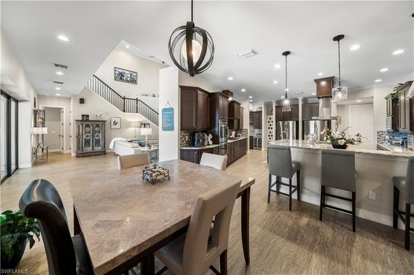 Dining room, Interior, Kitchen, Pendant Lights, Recessed Lighting, Stainless Steel Appliances, Wood Texture Flooring