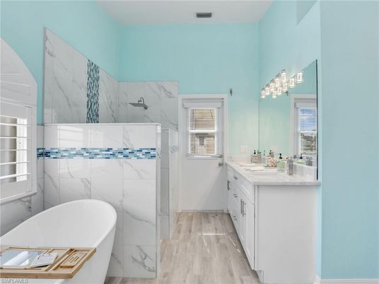 Bathroom, Free Standing Baths, Interior, Marble Walls, Wood Texture Flooring