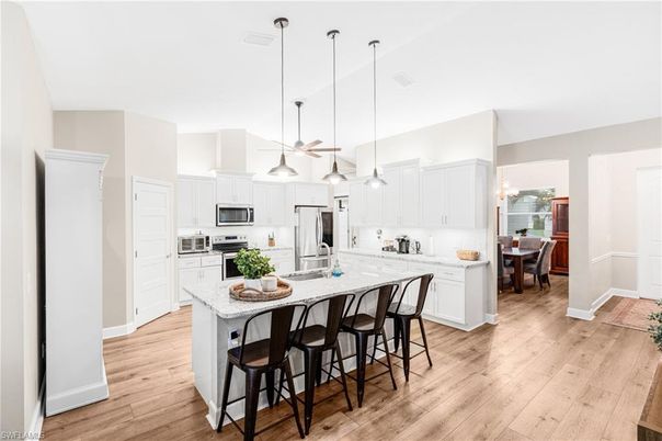 Dining room, Interior, Kitchen, Pendant Lights, Stainless Steel Appliances, Wood Texture Flooring