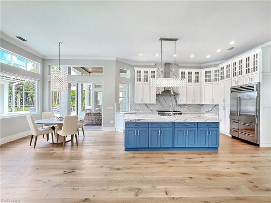 Chandelier, Dining room, Interior, Kitchen, Pendant Lights, Recessed Lighting, Stainless Steel Appliances, Wood Texture Flooring