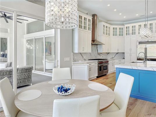 Dining room, Interior, Kitchen, Marble Walls, Pendant Lights, Recessed Lighting, Stainless Steel Appliances, Wood Texture Flooring