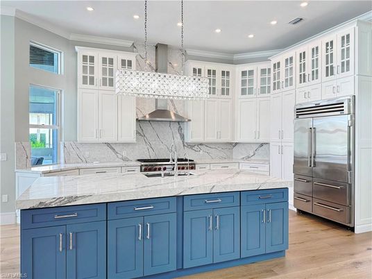 Interior, Kitchen, Marble Walls, Pendant Lights, Recessed Lighting, Stainless Steel Appliances, Wood Texture Flooring