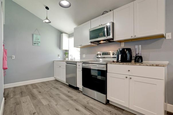 Interior, Kitchen, Pendant Lights, Stainless Steel Appliances, Wood Texture Flooring